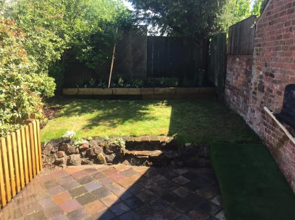 Garden makeover with new lawn, paved patio, rockery and picket fencing