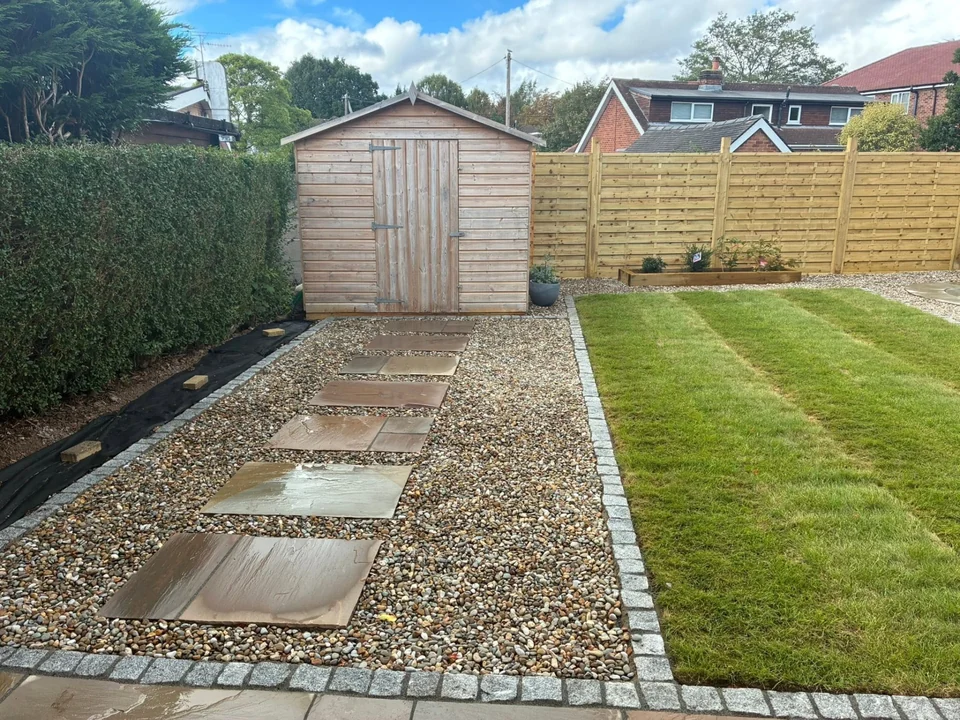Block Paving in Chester. Hard landscaping with stepping-stone gravel path, granite sett edging and lawn leading to a shed