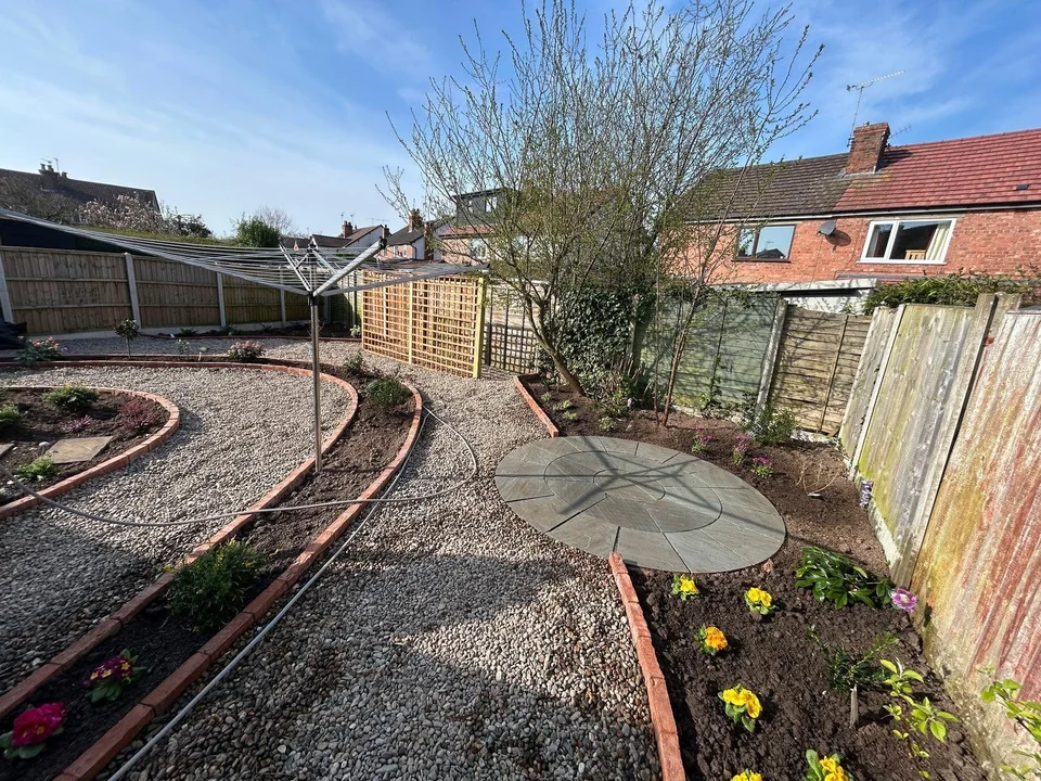 Landscaped garden with curved gravel paths and planted borders by Chester Garden Services